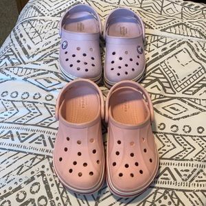 2 pairs of crocs